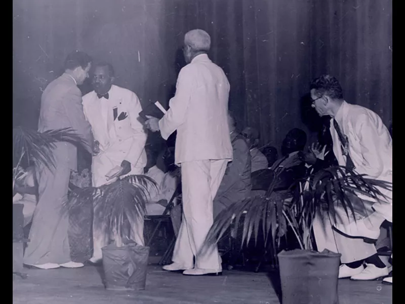 people receiving an award on stage