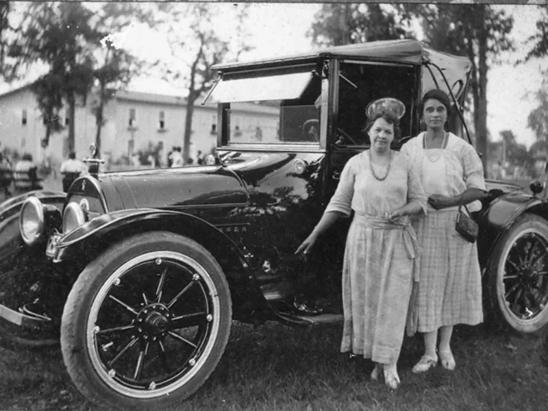 two women next to car
