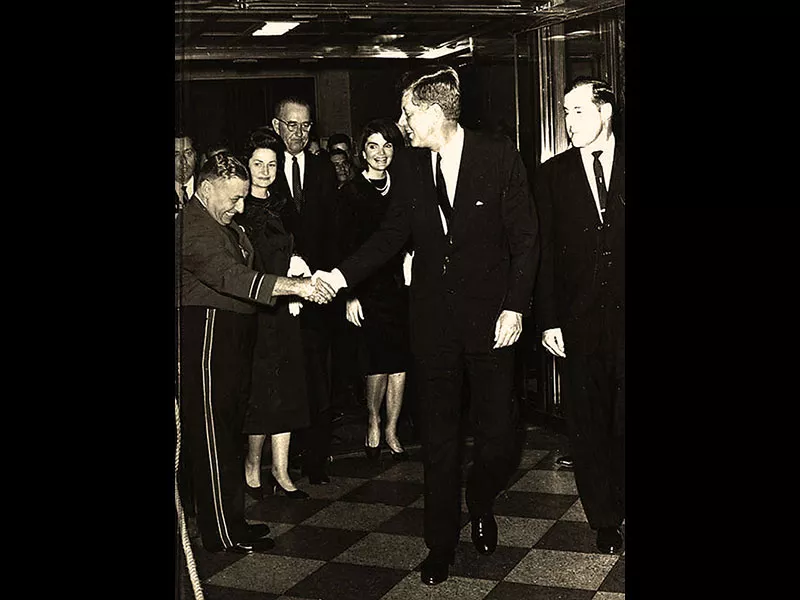 ...President John F. Kennedy greeting an unidentified man at Houston LULAC banquet