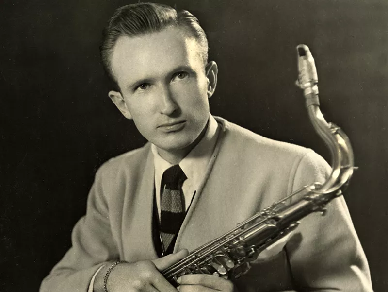 Portrait of Ed Gerlach with his saxophone.