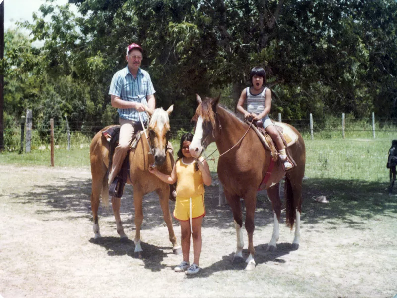  Raul C. Martinez (left), riding a horse, a child standing next to the horse, and one child riding a horse (right).