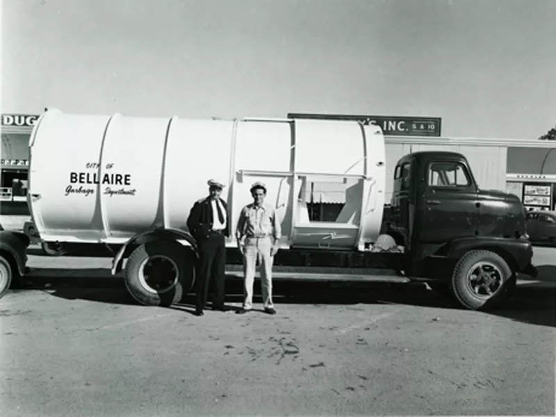 Men in front of the City of Bellaire Garbage Department truck
